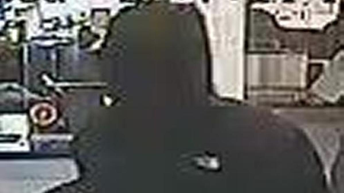Federal authorities said a man in a black mask wearing a black sweatshirt and dark colored pants robbed Country Club Bank in Kansas City.