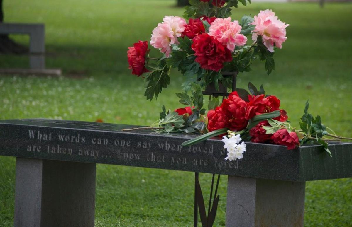 A bench in the Victims Memorial Garden at Phelps Grove Park is dedicated to the three missing women. The women’s names and the date of their disappearance are etched in its surface.