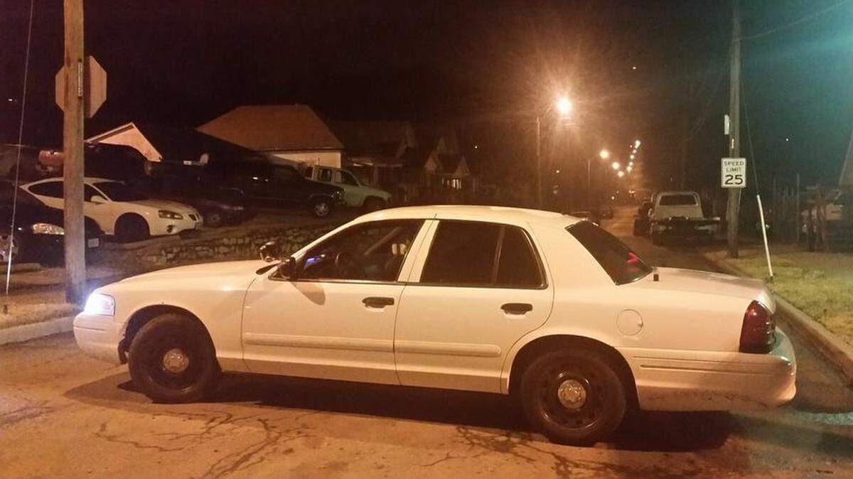 An unmarked Kansas City police car blocked the street Tuesday night near 27th Street and Lister Avenue as tactical officers negotiated with a person they thought was involved in a shooting.