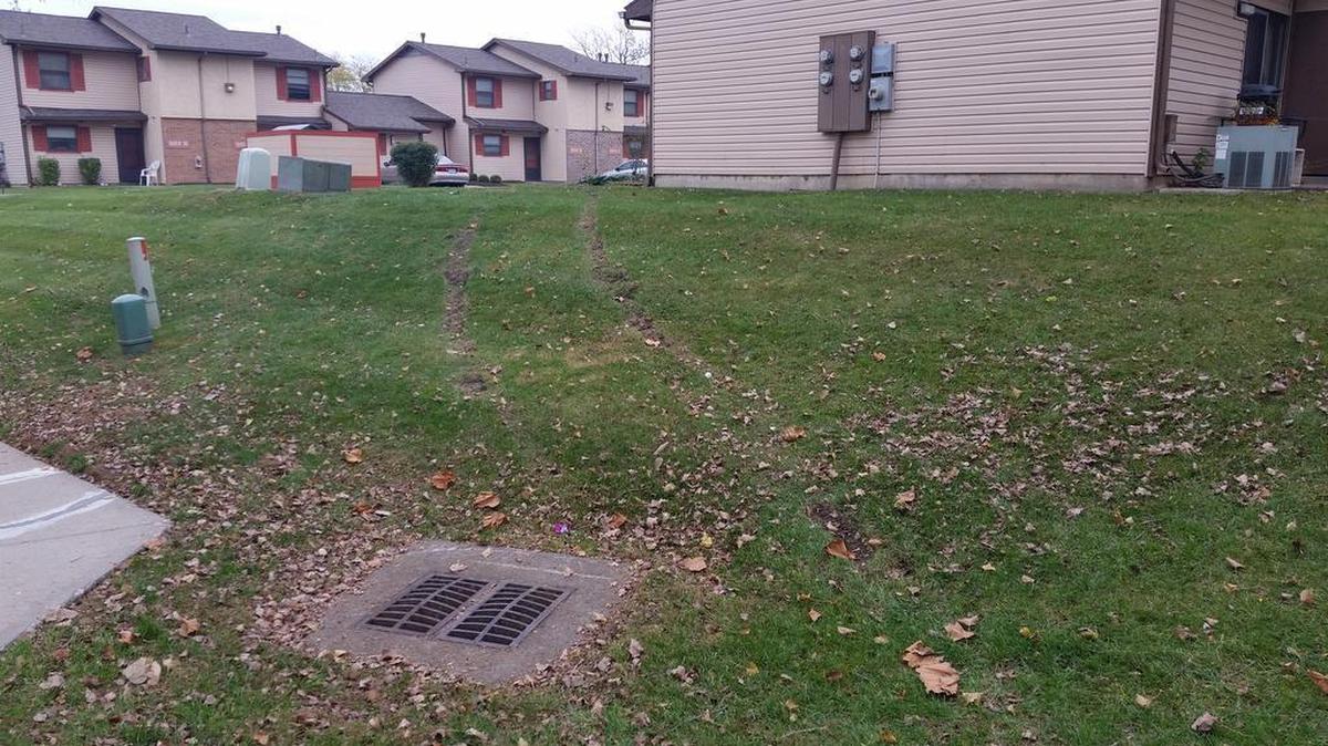 Skid marks remained on a grassy hill near a unit in the Ashbrooke Apartments in Lee’s Summit where a police officer discovered the body of Tanya Chamberlain in the passenger seat of a car. Chamberlain, 43, of Lee’s Summit, was found stabbed to death after a vehicle stop early Sunday morning.