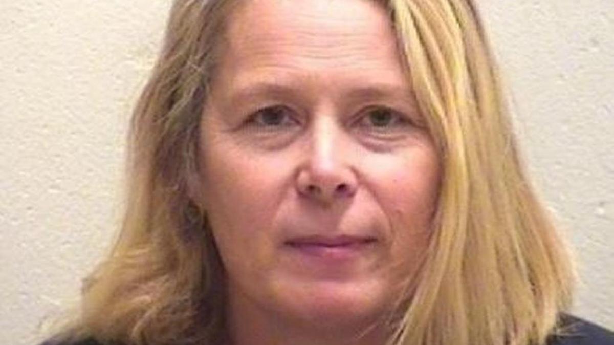 Murder charges were dropped Friday against Carolyn J. Heckert of Smithville, accused of killing a teenager nearly 30 years ago.