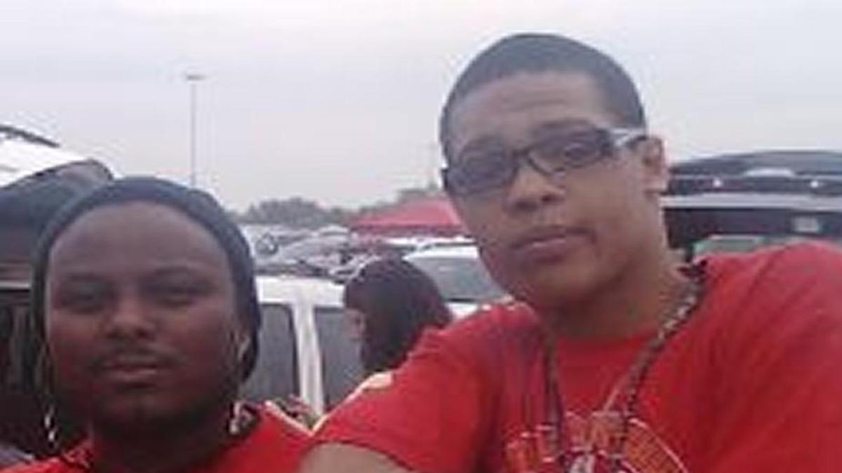 Antonio Dennis (left) and his son, Shaquil J. Roland, attended a Chiefs game in 2013.
