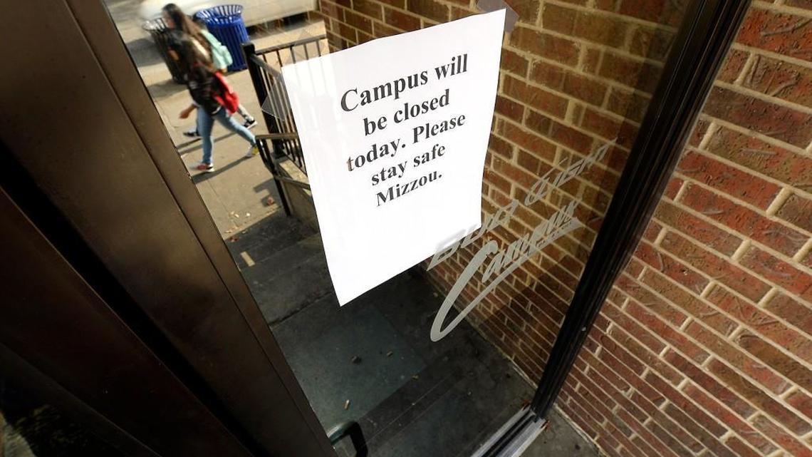 A sign on the door of the Campus Bar & Grill, across the street from the University of Missouri campus in Columbia, showed that it was closed Wednesday morning amid fears related to online death threats and unsubstantiated rumors of acts of aggression against students.