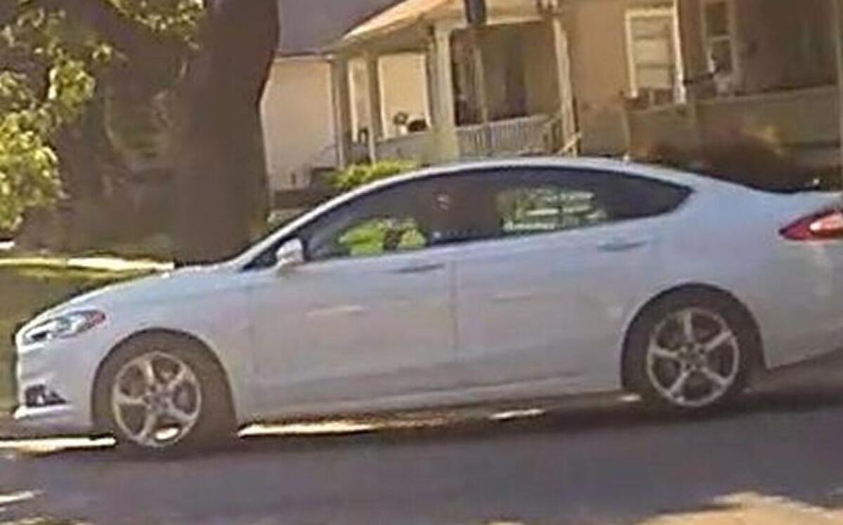 Lawrence police are looking for a white Ford Fusion with Missouri license plates after an officer was injured Tuesday while making a traffic stop. The car bears the license number SM6W3R.