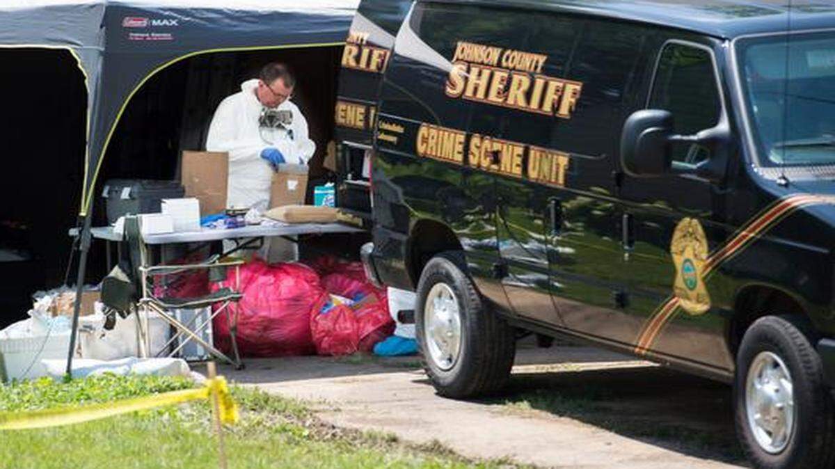 
Crime scene technicians and law enforcement collect evidence and investigate the scene of a murder in the 7900 block of 75th Street Wednesday in Overland Park.
