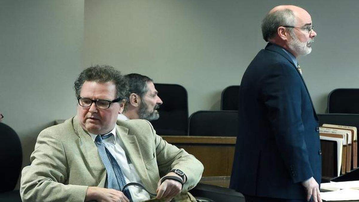 
Defense attorney Ron Evans (left) collected his belongings Friday after being allowed to withdraw from the defense team of F. Glenn Miller Jr. (center background), accused of shootings at Overland Park Jewish centers. Remaining defense attorney Martin Warhurst spoke at the court hearing. 
