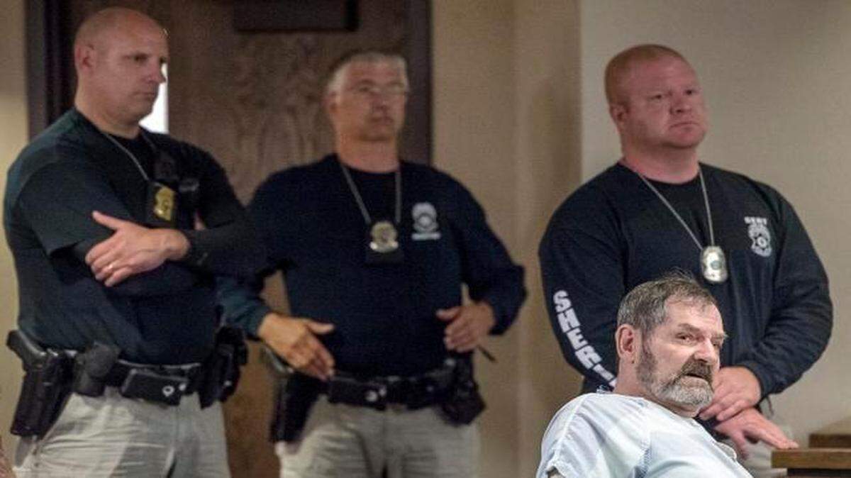 
F. Glenn Miller Jr. was surrounded by Johnson County sheriff’s deputies Friday during a hearing at the Johnson County Courthouse in Olathe.
