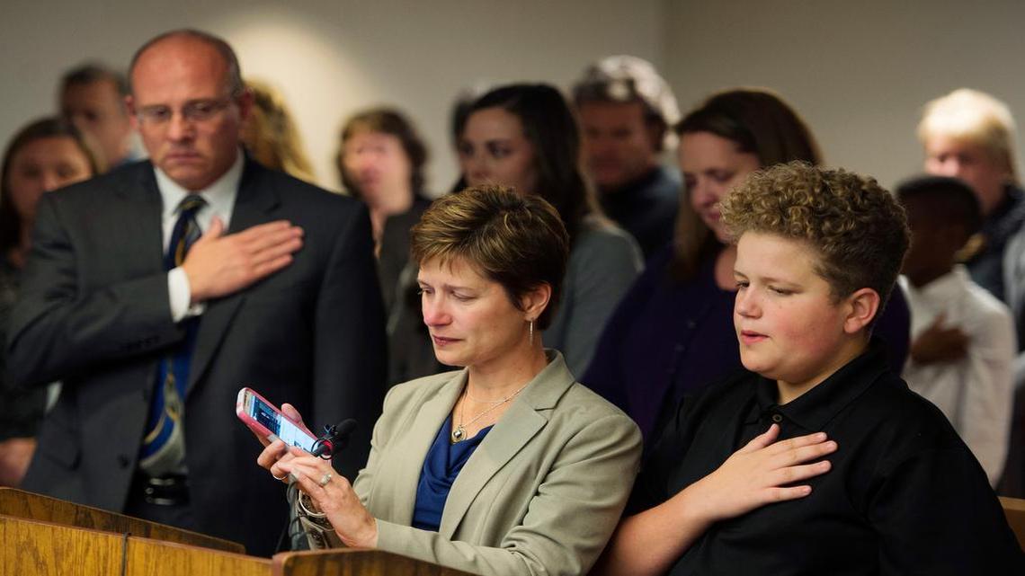 The three people murdered in last year’s Overland Park shooting rampage were remembered at the killer’s sentencing hearing Tuesday. Those in the Johnson County courtroom stood as Mindy Corporon played a recording of her son, 14-year-old murder victim Reat Underwood, singing “The Star-Spangled Banner.” At her side was her son 13-year-old Lukas Losen; District Attorney Steve Howe was at left. The two other murder victims were Reat’s grandfather, William Corporon, and Terri LaManno.