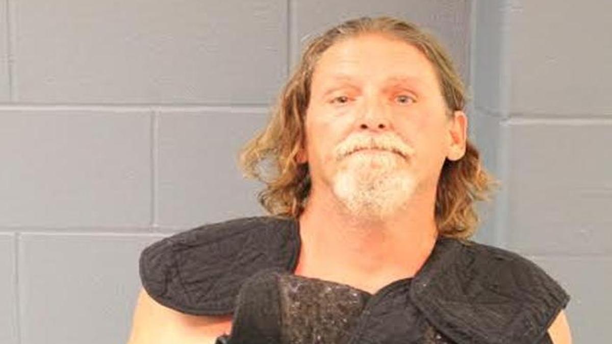 When officers arrested Brian Parks, they found a shotgun with two spent slugs and a handgun with two empty cylinder slots in his truck. Parks also reportedly had blood on his clothing and rings.