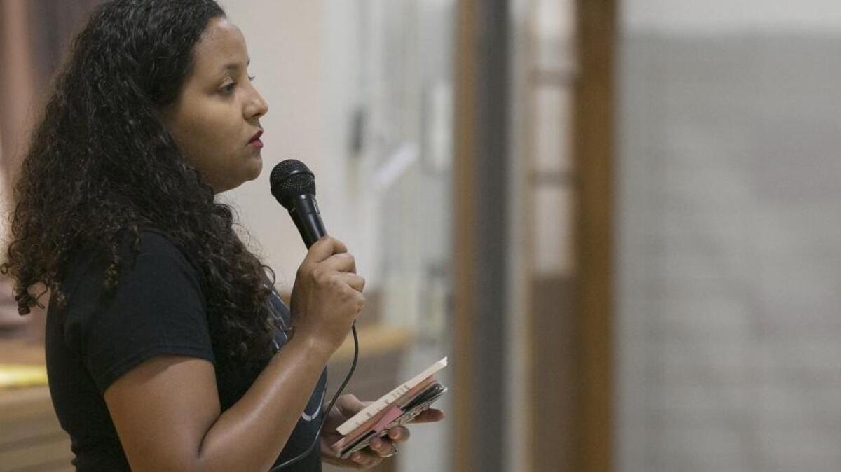 Ashley Haden-Peaches with One Struggle KC explained the rules for a forum held Sunday at the Mary L. Kelly Community Center. The forum was organized to give the community a place to express their feelings about the recent killings of black men by police across the country.