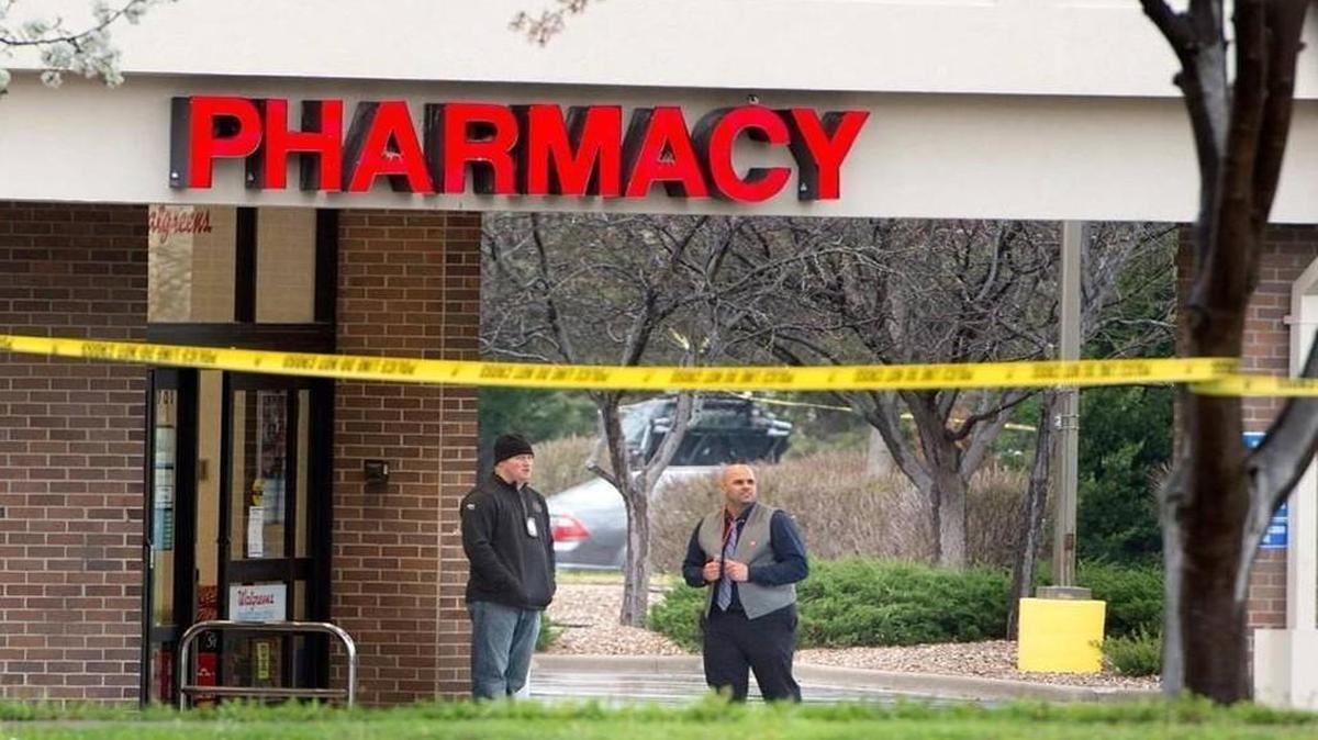 Crime scene tape surrounded a Blue Springs Walgreens, where authorities shot and killed a man suspected in a robbery early Thursday.