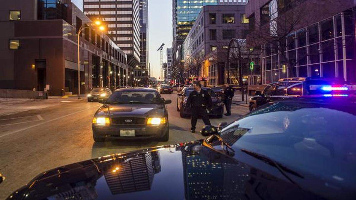 
Police investigated the scene of a police shooting Friday on Main Street in downtown Kansas City. The shooting followed the alleged use of a bomb to rob a bank. 
