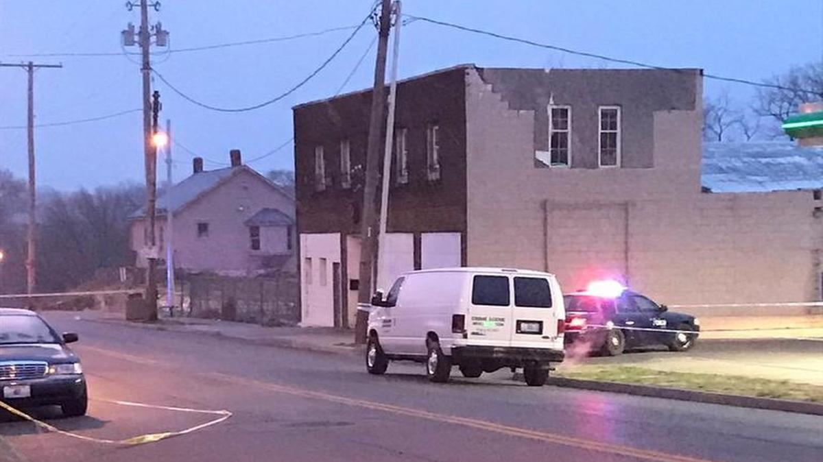 Police investigators work the scene of an early Saturday morning shooting in the 2100 block of East 39th Street.