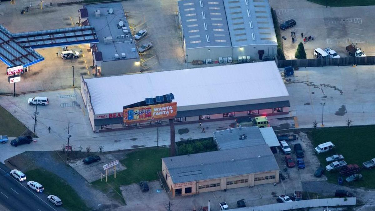 In this aerial photo, investigators work the shooting scene in Baton Rouge, La., where several law enforcement officers were either shot or killed Sunday. Multiple police officers were killed and wounded Sunday morning in a shooting near a gas station in Baton Rouge, less than two weeks after a black man was shot and killed by police here, sparking nightly protests across the city.