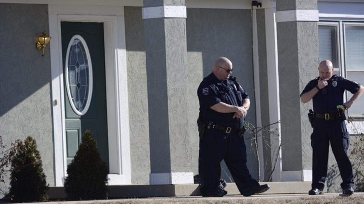 
Olathe police officers worked outside a home near 112th Terrace and 112th Street as they investigated a shooting on Thursday.
