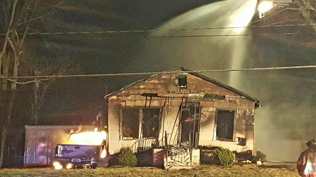A stolen pickup fleeing from police crashed into an Independence house causing the truck and the house to burst into flames late Sunday.