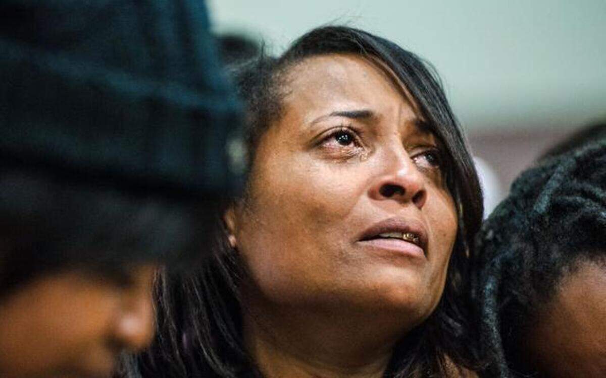 
At a prayer vigil Tuesday in Kansas City, Kan., for her slain daughter, Angela Fowler was comforted by people around her. Fifth-grader Machole Stewart, 10, was shot to death Sunday when someone in a passing vehicle fired several times into the girl’s home. 
