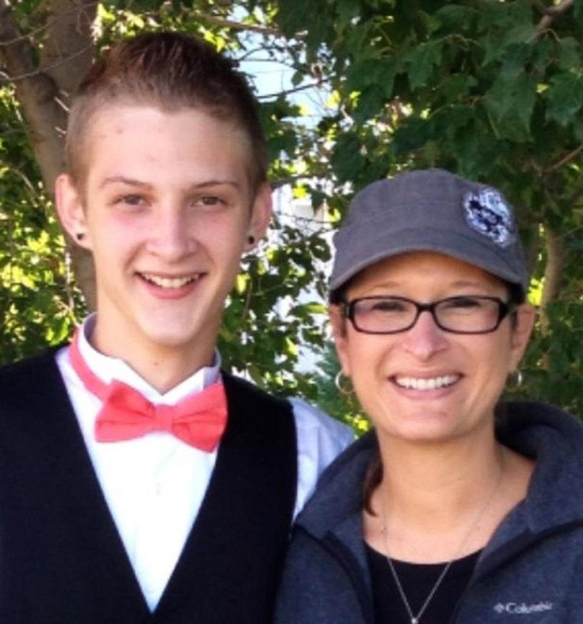 In this photo provided by Daniel J. Haus, attorney for the family, is Bryce Masters with his mother, Stacy Masters.