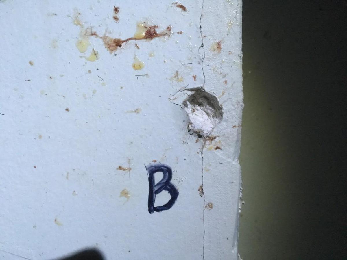Ciara Howard’s family took this photo showing one of the bullet holes in the laundry room wall left by one of the gunshots that killed her Aug. 23, 2017.