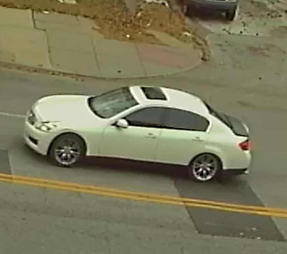 Authorities are trying to identify the owner or occupants of a white Infinity with a black trunk lid seen leaving the scene.
