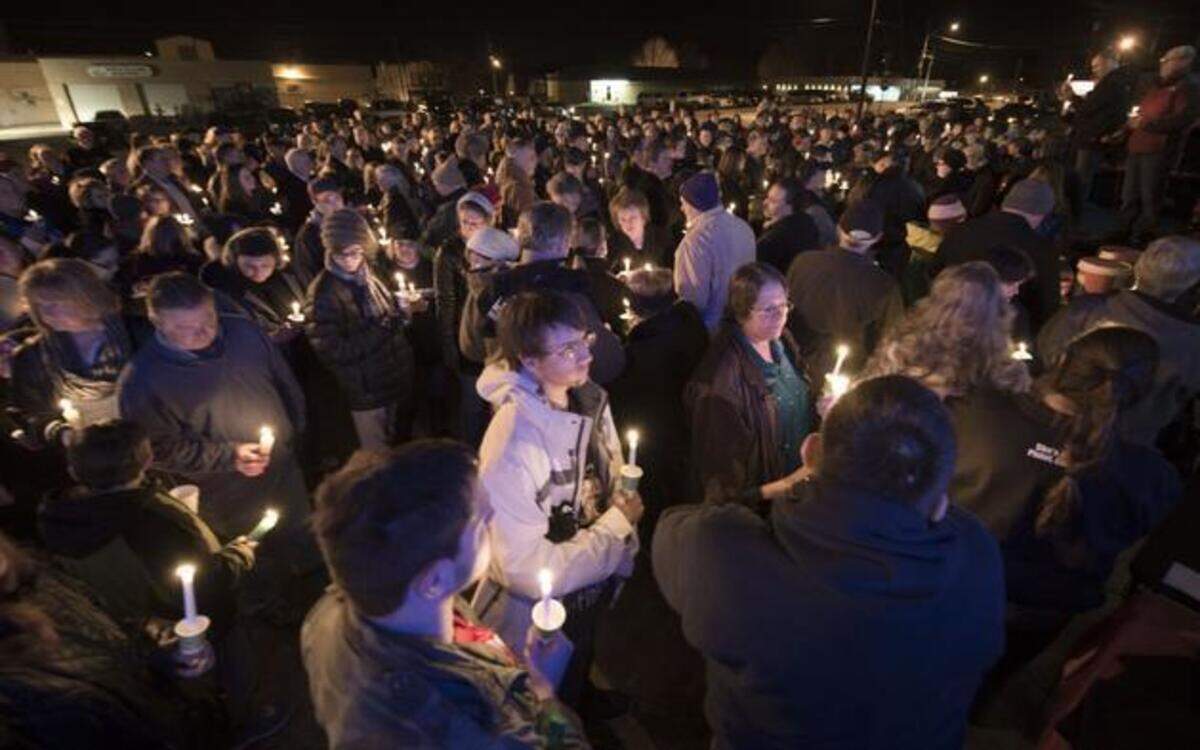 
In one of two area vigils Thursday night in memory of homicide victims, mourners packed a parking lot in Shawnee for a candlelight vigil outside the She’s a Pistol gun shop. The shop’s co-owner, Jon Bieker, was killed during a robbery attempt last week. Local business owners organized the vigil as a way to honor Bieker and his family.
