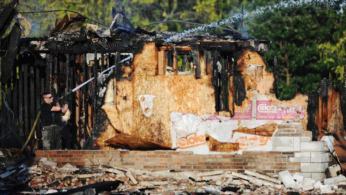 A firefighter worked to extinguish the smoldering remains of the Islamic Society of Joplin on Aug. 6, 2012 in Joplin, Mo. Jedediah Stout, 32, of Joplin, Mo., admitted Monday in federal court that he burned down the mosque and tried to burn down a Planned Parenthood clinic in Joplin in 2013.