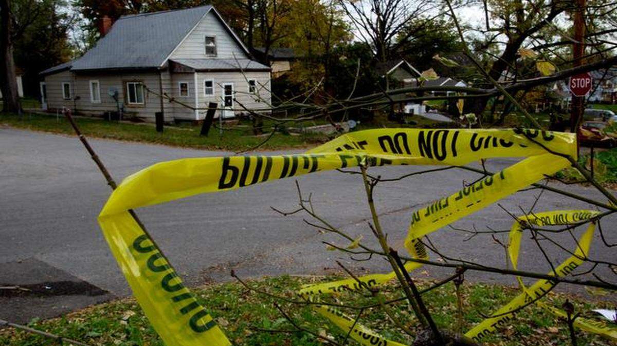 
Crime-scene tape was tangled in a tree Monday at 15th Street and New Jersey Avenue in Kansas City, Kan., across from the home where Machole J. Stewart was killed Sunday night. She died after someone in a passing vehicle sprayed bullets into the house. 
