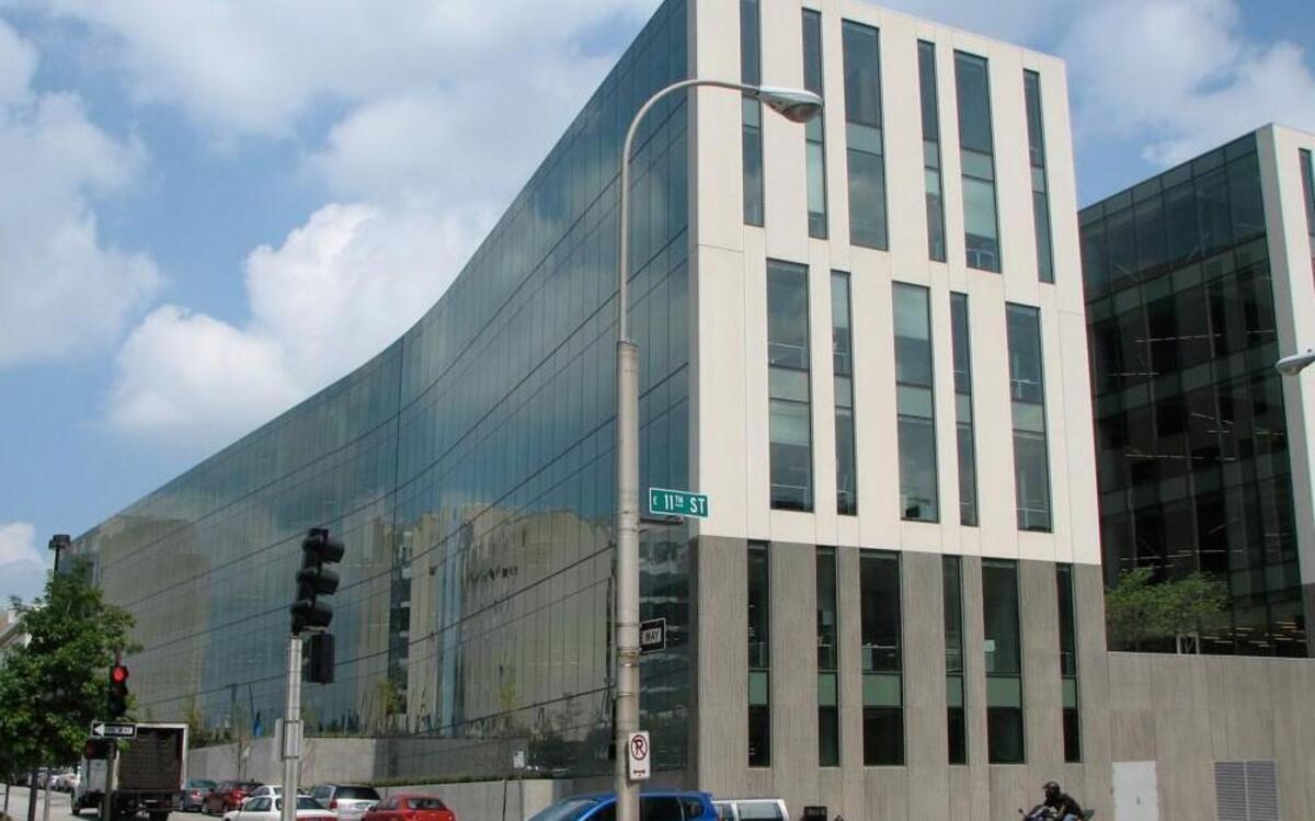 A former JE Dunn job recruiter is accused of taking kickbacks from recruitment services.
