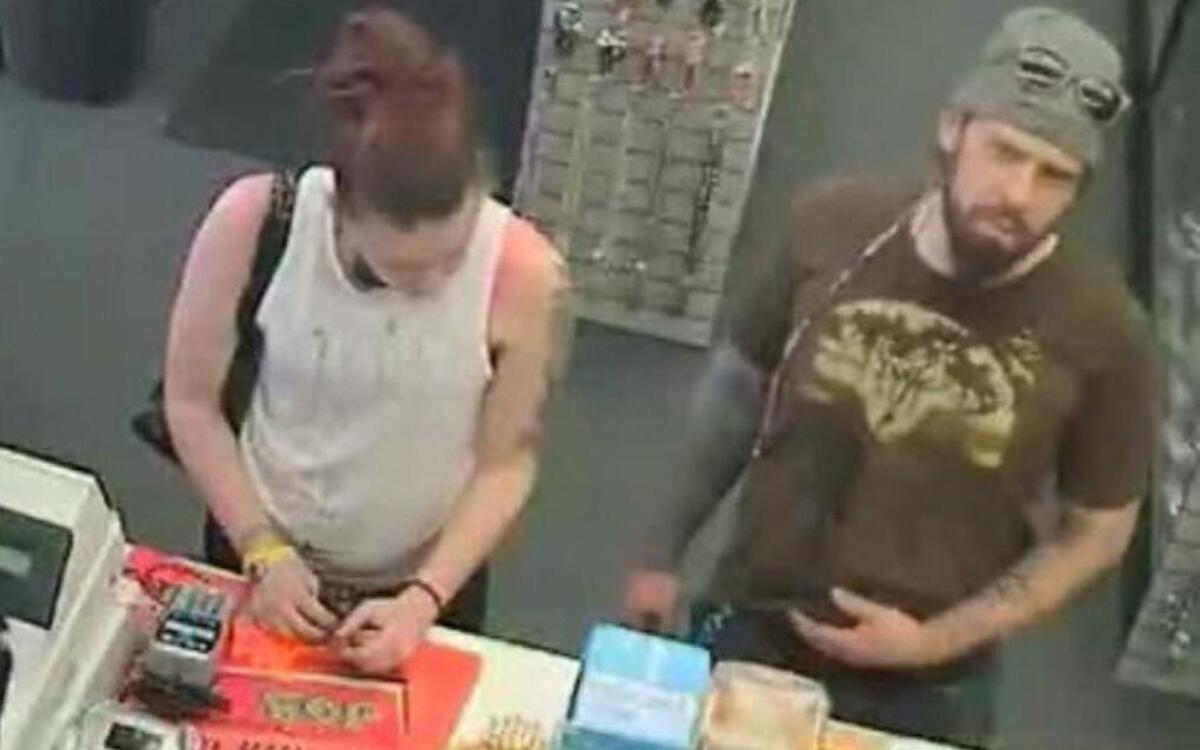 Authorities in Lenexa released surveillance photos of two people suspected of theft and fraudulent use of a credit card. The first suspect is a thin- to medium-built white man with a brown beard and mustache. The second suspect is a white female in her mid-20s to 30s with a medium build, long brown hair with a reddish tint.