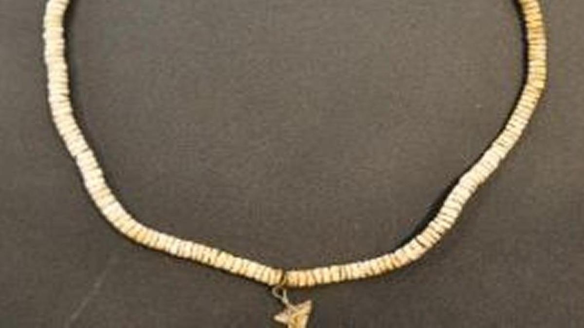 This necklace was found with human remains in Kansas City, Kan.