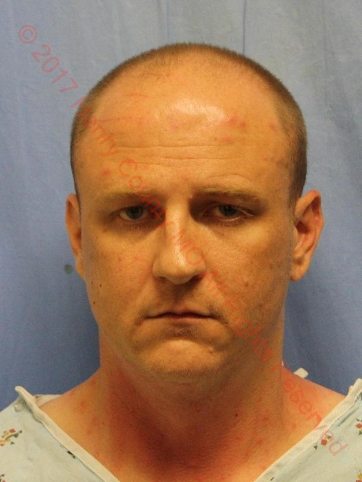 Ian McCarthy, 39, of Clinton, Mo., accused in the fatal shooting of Clinton, Mo., police officer Gary Michael, was booked into the Henry County jail early Wednesday.