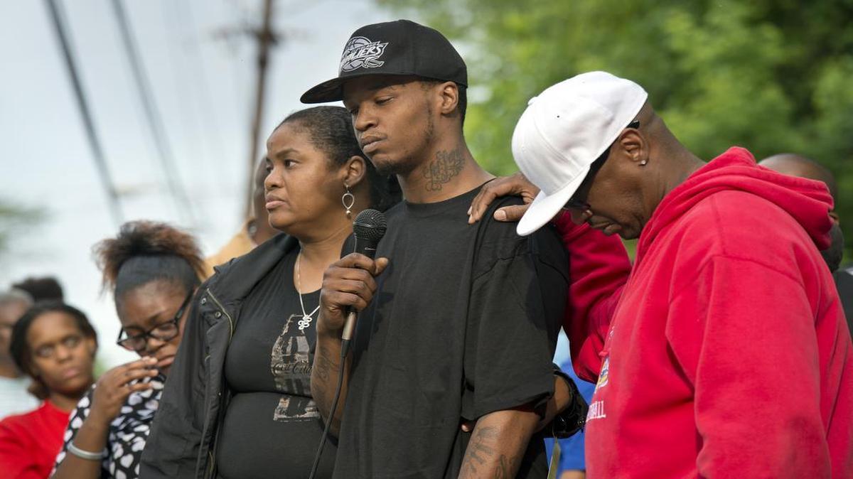 
A vigil for 3-year-old Amorian Hale was held Wednesday evening near the house where he was shot at 67th Street and Walrond Avenue. The boy's father, Christopher Hale (center), spoke at the vigil.

