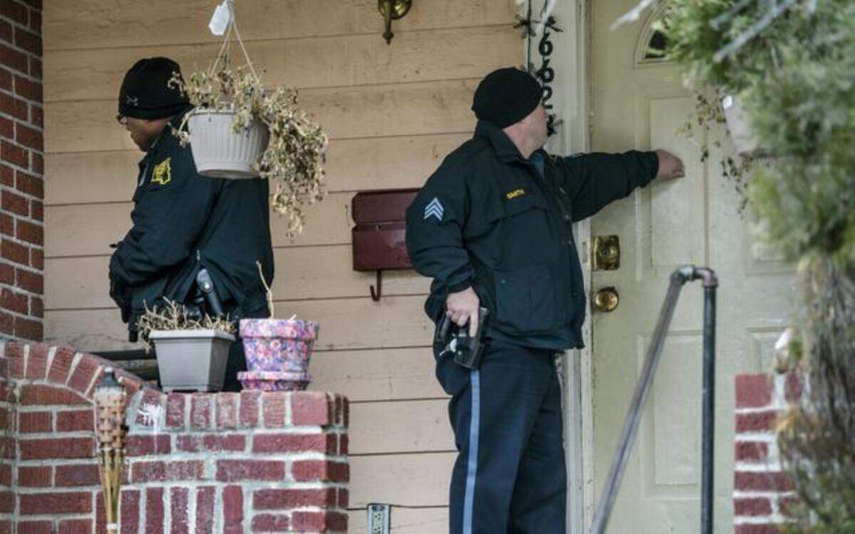 
Officer Anthony Watt (left) and Sgt. Tim Smith knocked on a south Kansas City house Tuesday during a law enforcement initiative led by the Kansas City No Violence Alliance.
