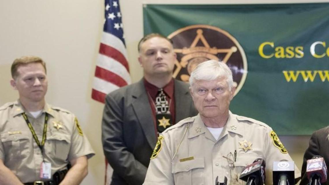 In this file photo from 2014, then-Cass County Prosecutor Teresa Hensley and Cass County Sheriff Dwight Diehl answered questions after a press conference announcing that Mathew Volland, of Raymore, and Tyler Smallwood, of Peculiar, were charged with first-degree murder and armed criminal action in the shooting death of Forrest Fuller, 25. Hensley left the prosecutor’s office before Smallwood’s case went to trial. Other authorities, including Maj. Jeff Weber (back row, left) and Detective Sgt. J. Becker-Schutte, attended the news conference.