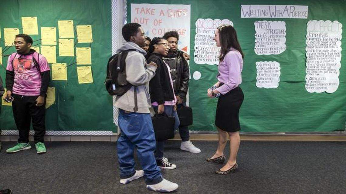 
Assistant principal Sharon Ahuna (right) often checks in with Center High School students, including Malik Collins (front to back), Breauna Porter and Tyrese Gully, all 17. Chats sometimes help school faculty and administrators spot troubled students earlier.
