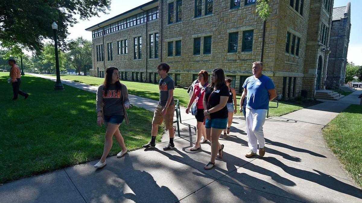 
Baker University student Brittney Harmon (left) led a tour for prospective students and their parents in July. Small colleges such as Baker strive to make personal connections as a way to appeal to potential enrollees. Go to KansasCity.com for a video.


