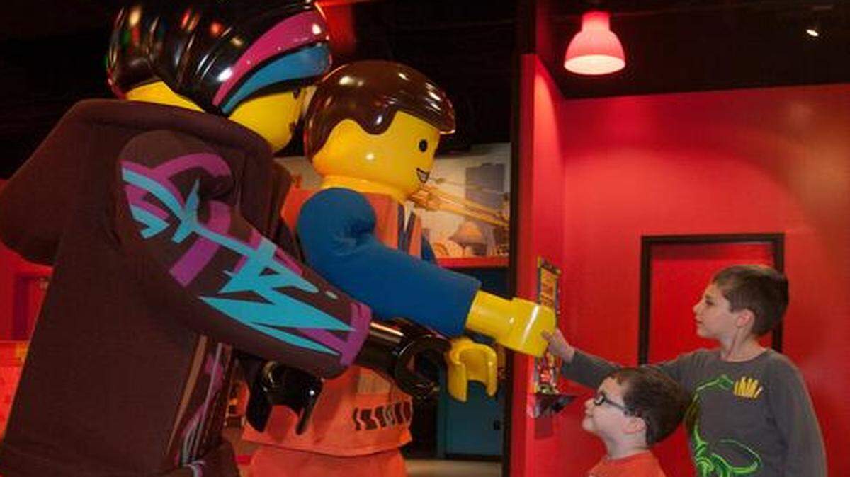
The Stars of The Lego Movie, Lucy (aka Wyld Style) (left) and Emmet, greeted brothers Harrison Lane, 2, and Sawyer Lane, 6, of Smithville at the Lego Movie weekend Sunday at the Legoland Discovery Center Kansas City at Crown Center.
