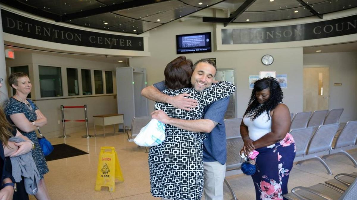 Richard Jones (middle) of Kansas City was released from jail Wednesday after serving nearly 17 years of a 19-year sentence for an aggravated robbery conviction. A judge overturned the conviction.