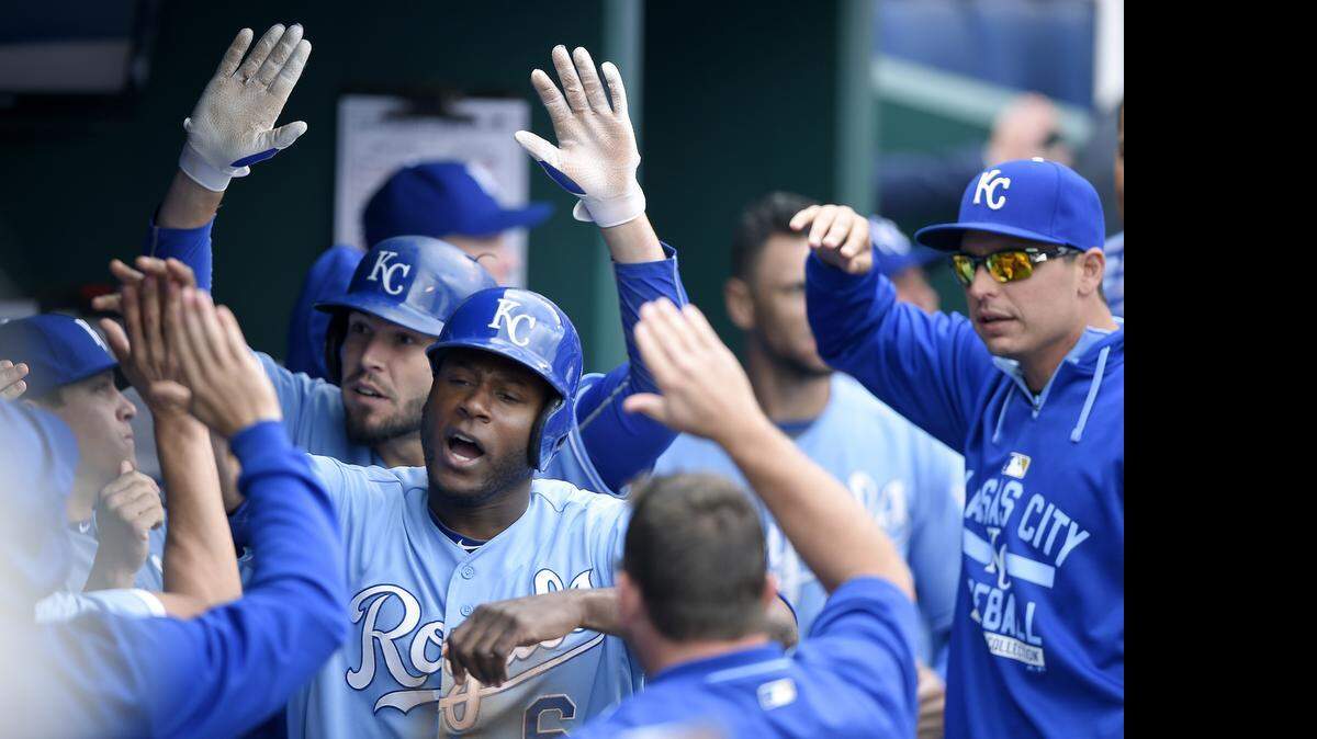 Lorenzo Cain and Eric Hosmer celebrated after scoring on a double by Kendrys Morales in the eighth inning to take the lead during Sunday's 4-2 win over Athletics on Sunday at Kauffman Stadium.
