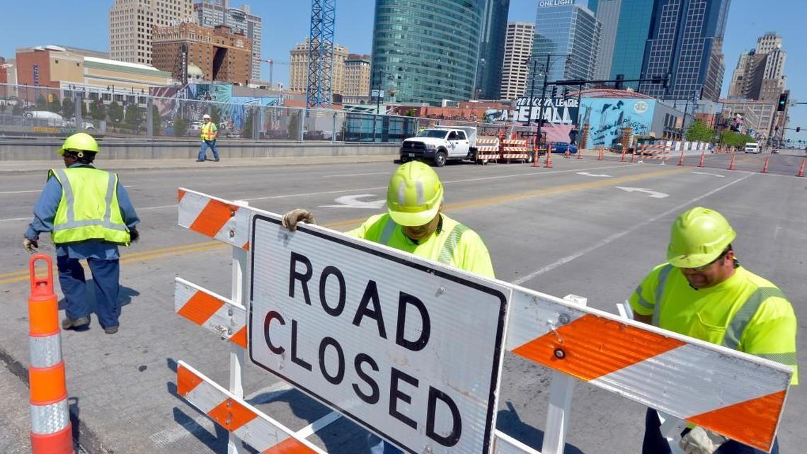 Missouri Department of Transportation workers used pylons and signs to close the Grand Boulevard Bridge over Interstate 670 Friday morning in downtown Kansas City. An emergency inspection prompted the closing of the bridge. MoDOT officials said in a news release that the bridge, south of the Sprint Center, had last passed inspection in September, but was “exhibiting signs of stress fractures and closed for further inspection and possible repairs.” It is uncertain when the bridge will reopen.