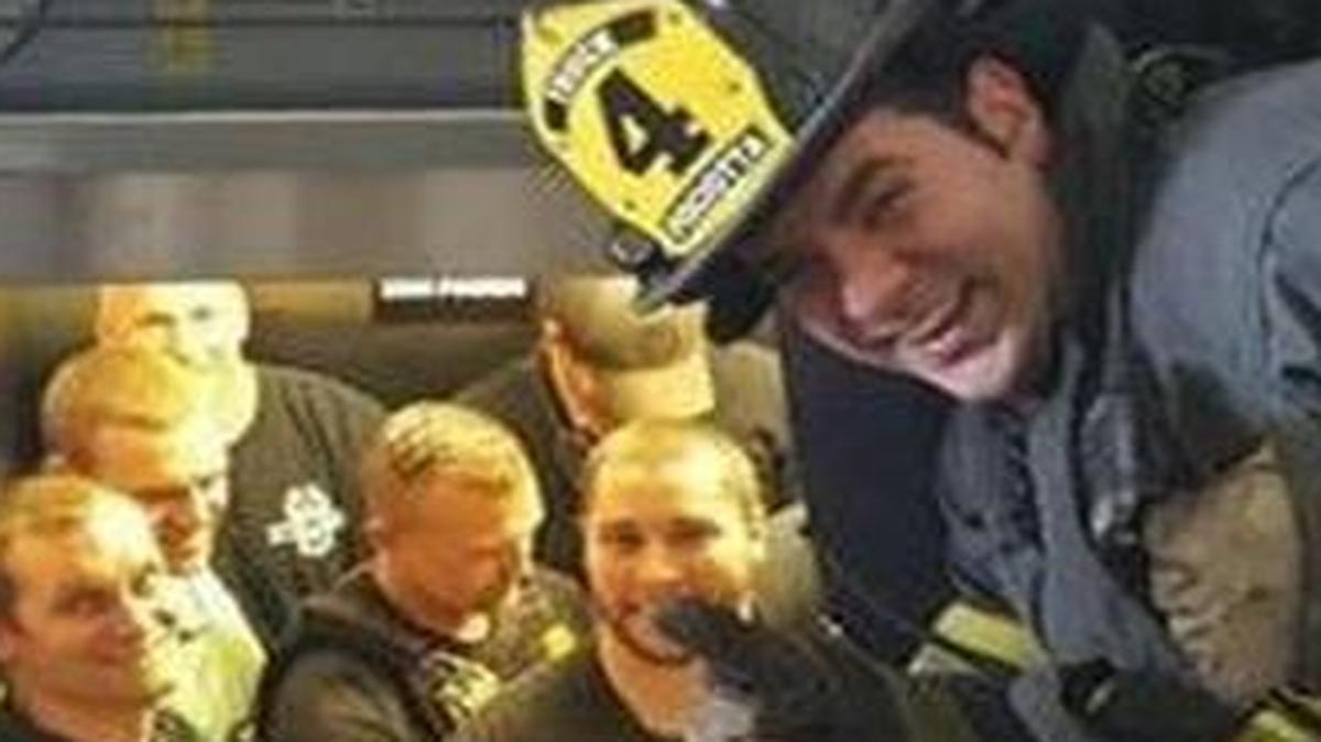 Kansas City firefighter Tony George Pisciotta gives a thumbs-up during a rescue of trapped Kansas City tactical police officers at the Regional Police Academy.