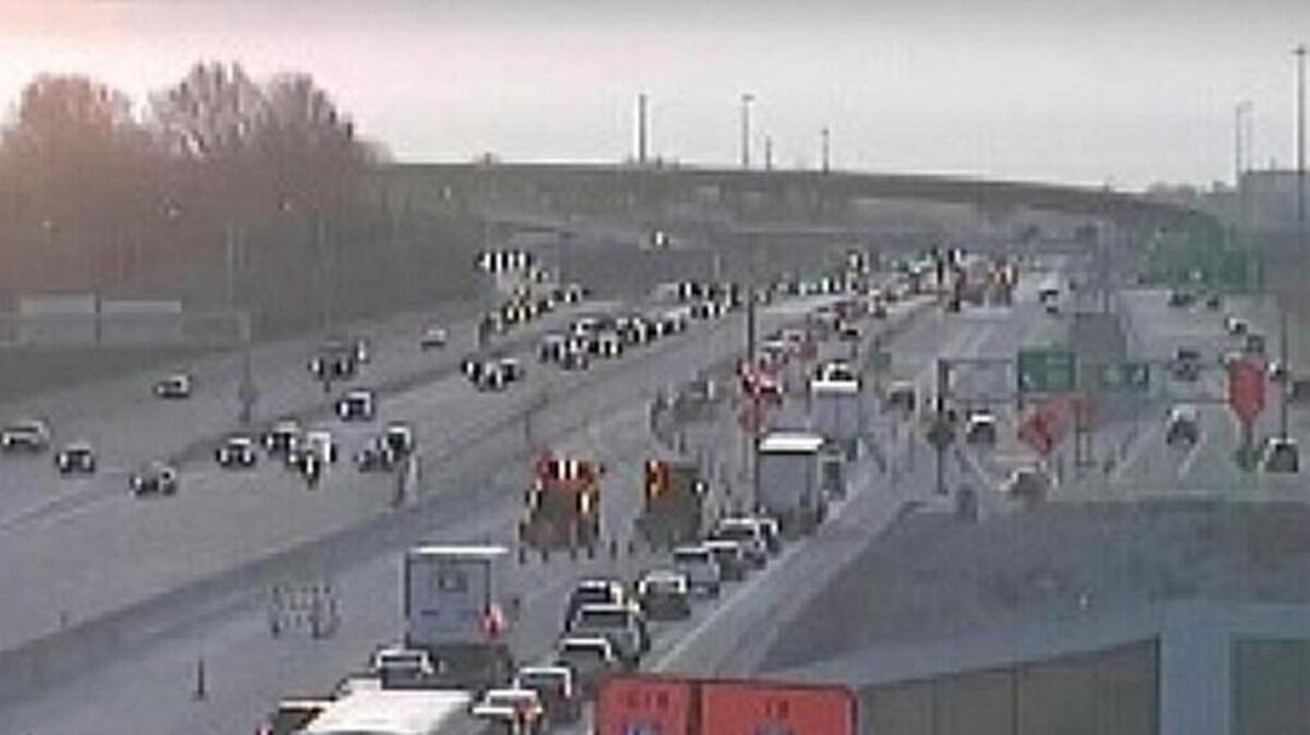 Traffic backed up along eastbound Interstate 435 after two morning rush-hour crashes that shoved more than 40 pieces of a concrete barrier wall.