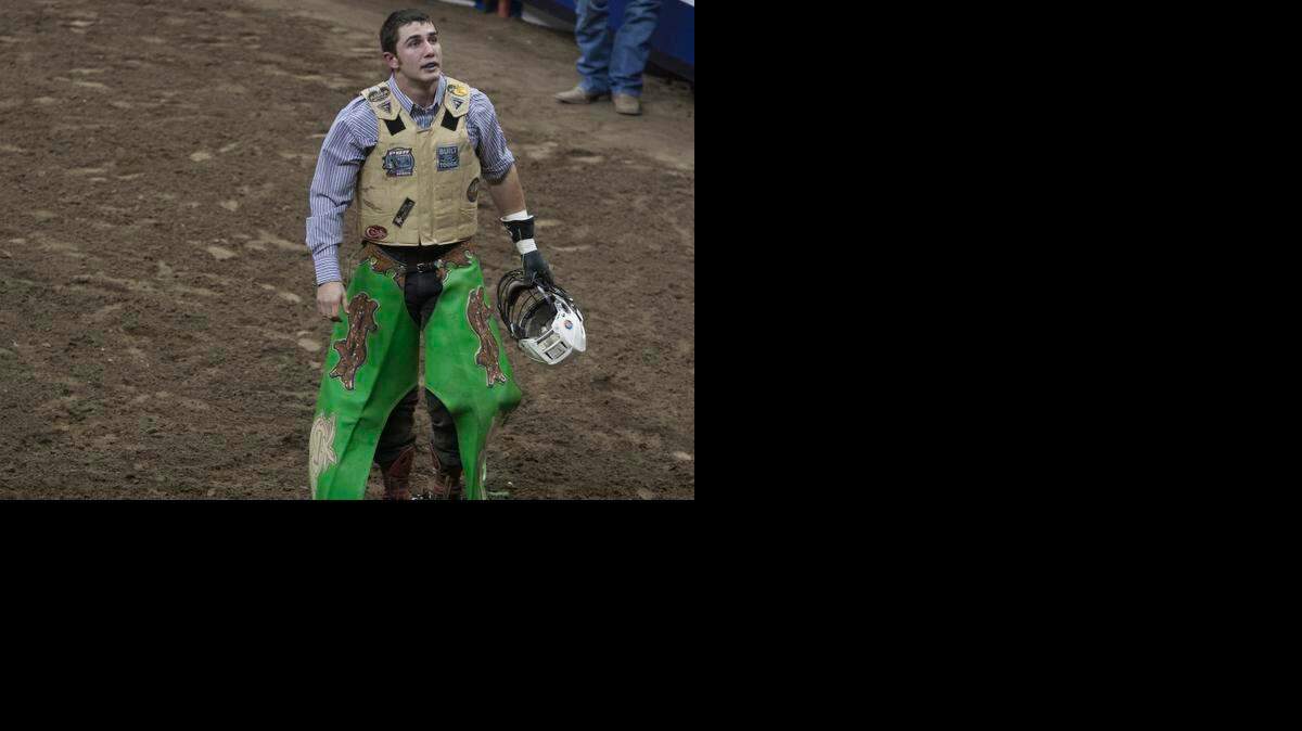 
Brady Sims of Holt, Mo, exited the arena after competing in the Professional Bull Riders' Caterpillar Classic Saturday, February 21, 2015 at the Sprint Center.
