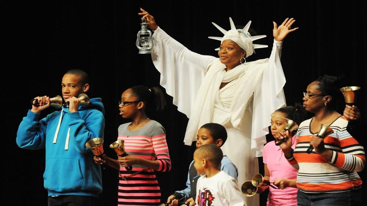 Adults and children performed Saturday at a Martin Luther King Jr. memorial at Blue Valley West High School in Overland Park.