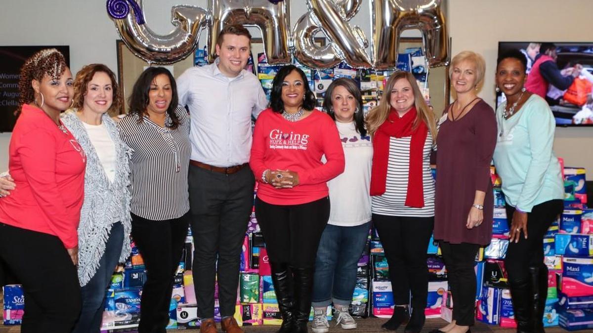 Jessica L. McClellan (center) founded Giving Hope & Help, a nonprofit that donated more than 40,000 feminine hygiene products to domestic violence shelters in 2017.
