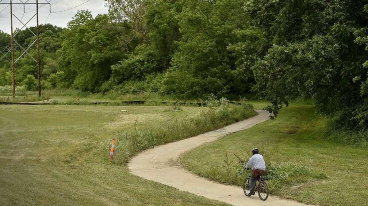 Kansas City officials said that security cameras will be installed along Indian Creek Trail between Holmes Road and State Line Road, including this section near 103rd Street and Wornall Road where a cyclist was using the trail May 22.