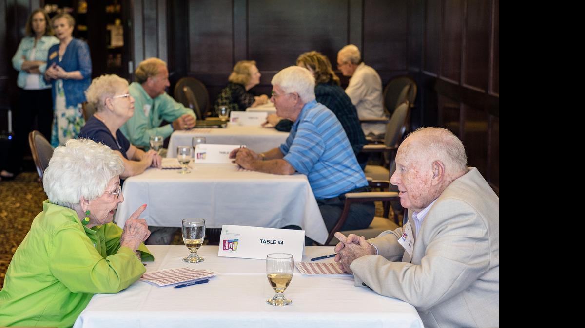 
Wanda Moore talks with Paul Galatas during “Coming of Age,” a speed dating event for people 55 years and older, on June 24 at McCrite Plaza at Briarcliff in Kansas City. The event, which rotates each man to talk to a different woman every six minutes, was sponsored by the Shepherd's Center Central.
