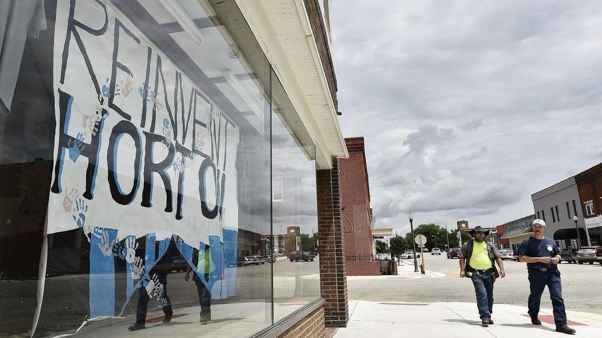 
The “Reinvent Horton” campaign has made a few improvements in the northeast Kansas town since TV personality and businessman Marcus Lemonis offered advice and money last year. One day last week, new Horton resident George Wingo (left) and English Leather Shop owner Luke Pollock walked through downtown.


