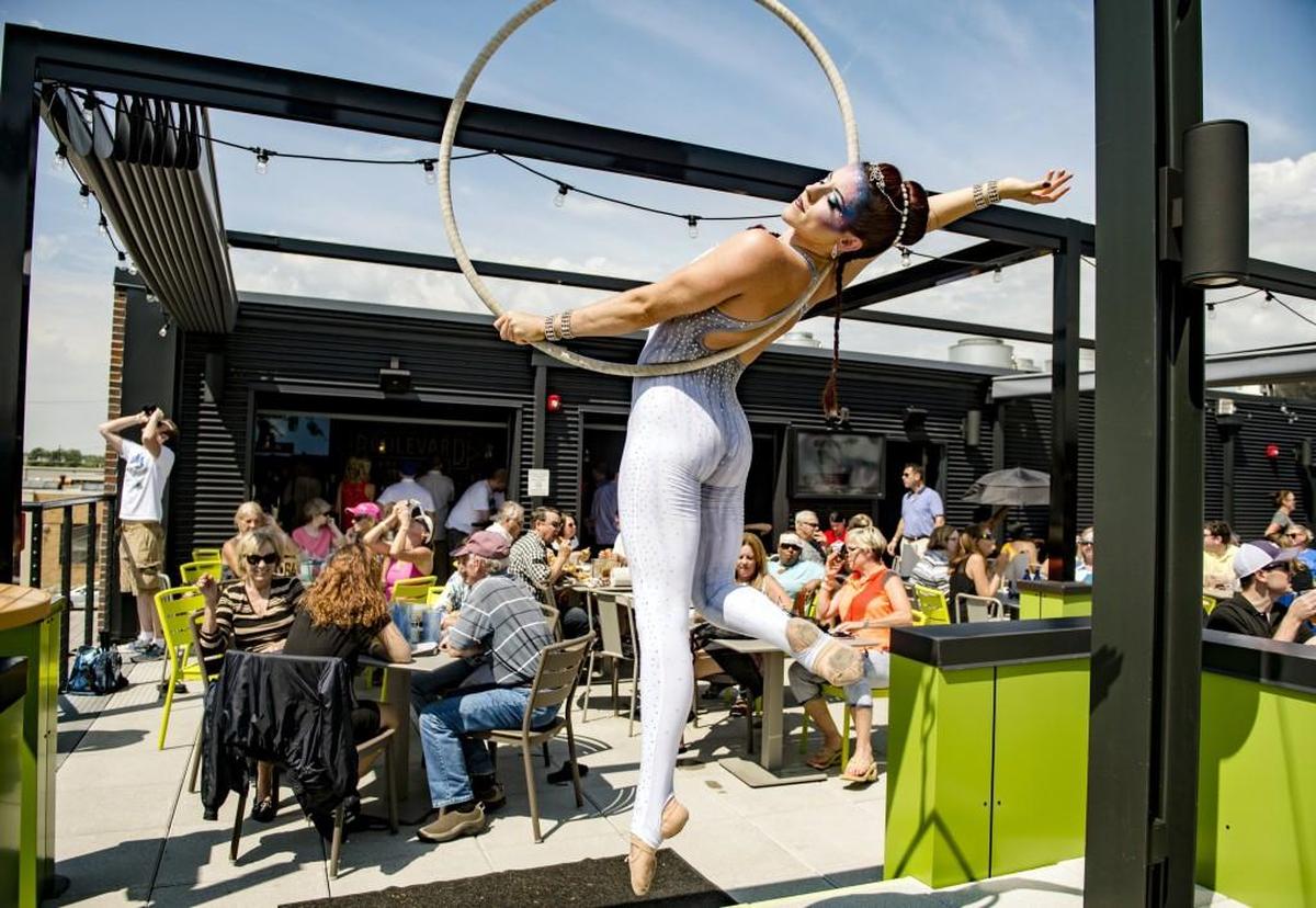 Aerialist Liv Morrow performed for customers on the rooftop of Chicken ’N Pickle.