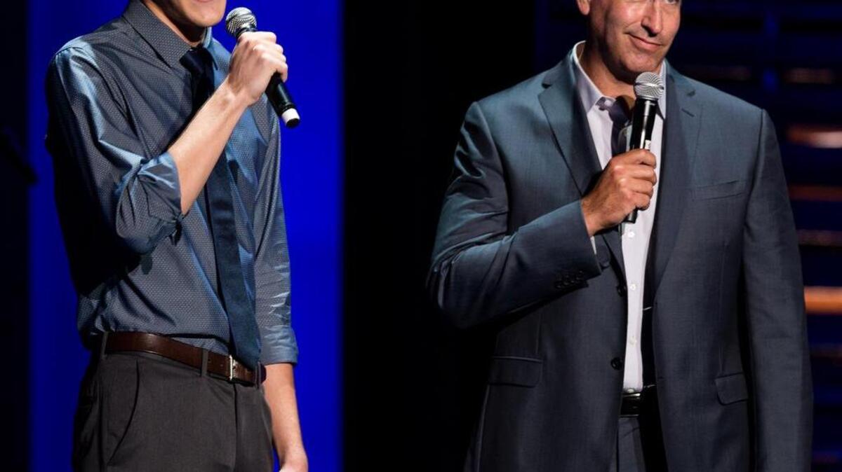 
The Master of Ceremonies of the 2015 KC SuperStar singing competition, Rob Riggle (right), introduced Austin Klein during the competition Sunday at Johnson County Community College. 
